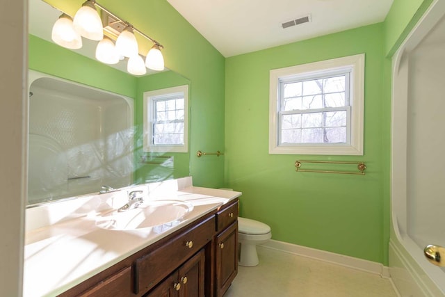 bathroom featuring vanity and toilet