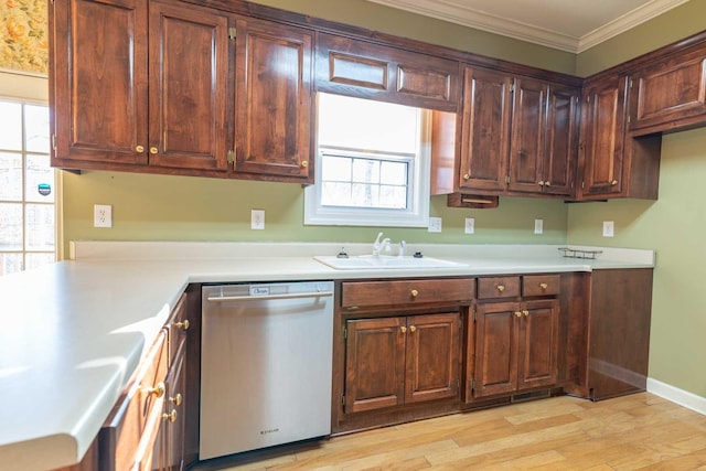 kitchen featuring stainless steel dishwasher, a wealth of natural light, ornamental molding, sink, and light hardwood / wood-style flooring