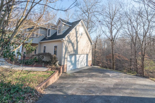 view of property exterior featuring a garage