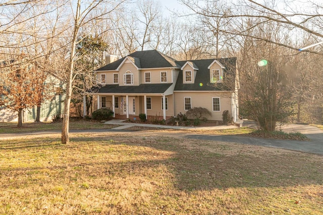 view of front facade with a porch and a front yard