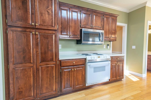 kitchen with white range with electric stovetop, crown molding, and light hardwood / wood-style flooring