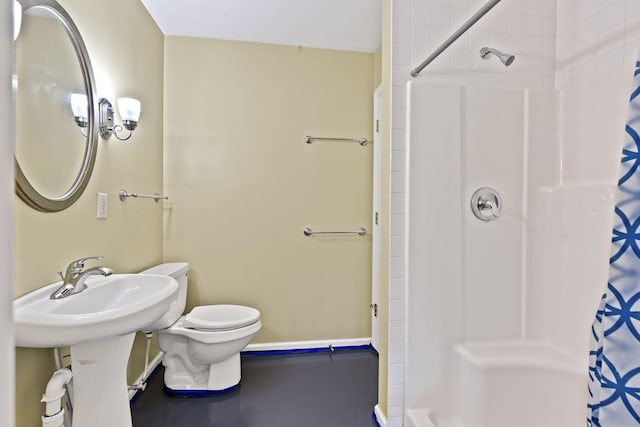 bathroom with curtained shower and toilet