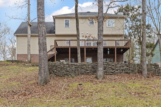 back of house with a deck