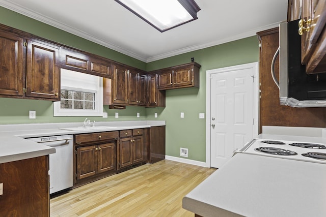 kitchen featuring sink, white appliances, light hardwood / wood-style flooring, dark brown cabinets, and ornamental molding