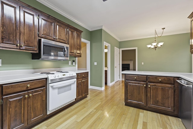 kitchen with dark brown cabinets, stainless steel appliances, light hardwood / wood-style floors, and hanging light fixtures