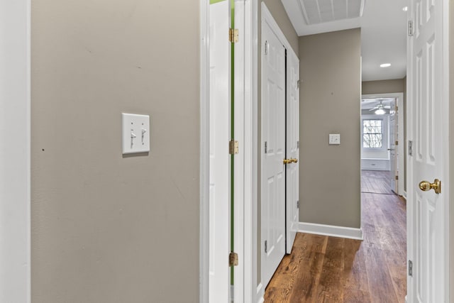 hallway featuring dark hardwood / wood-style flooring