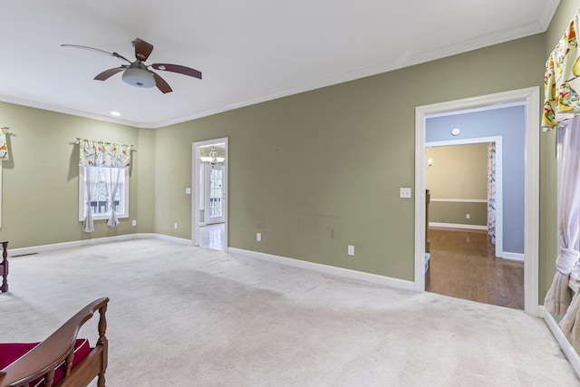 interior space with crown molding and ceiling fan with notable chandelier