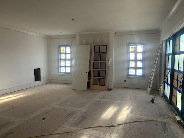 empty room featuring ornamental molding