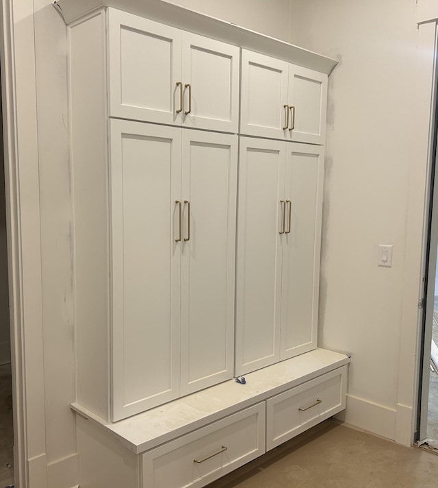 mudroom featuring concrete floors