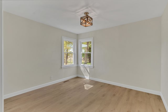 empty room with light wood-type flooring