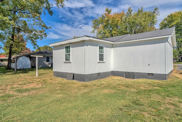 view of side of home featuring a lawn