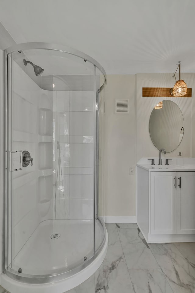 bathroom featuring vanity and an enclosed shower