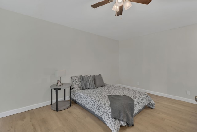 bedroom featuring hardwood / wood-style floors and ceiling fan