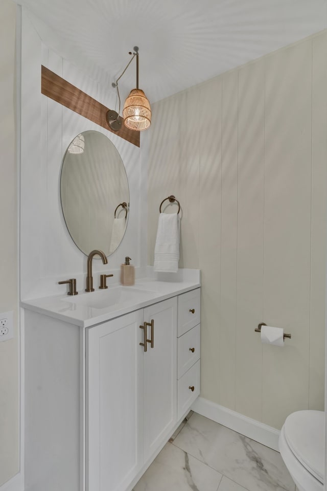 bathroom with vanity and toilet