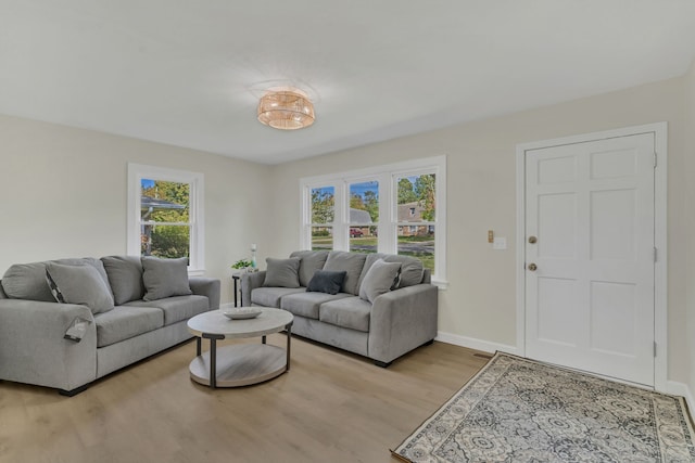 living room featuring light hardwood / wood-style flooring and plenty of natural light