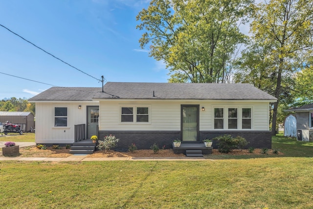 ranch-style house featuring a front lawn