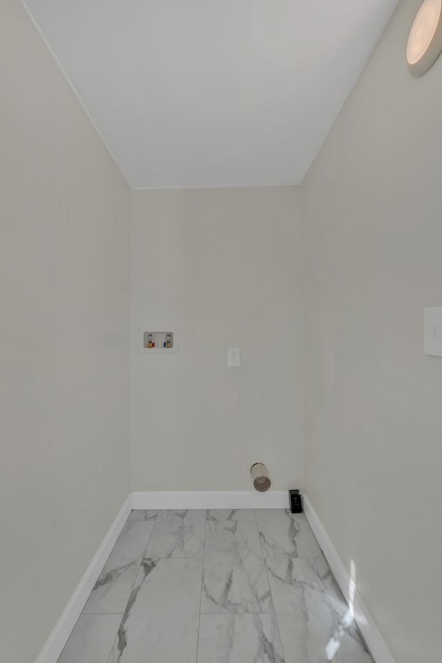 clothes washing area featuring wooden walls and hookup for a washing machine