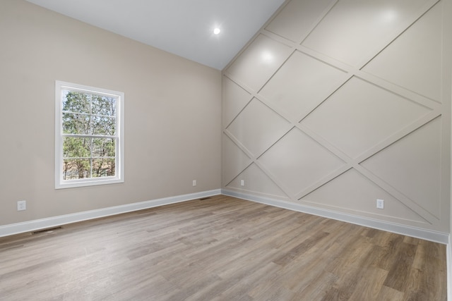 empty room with wood-type flooring