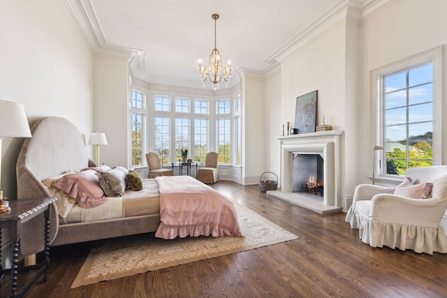 bedroom with crown molding, multiple windows, dark wood-type flooring, and a notable chandelier