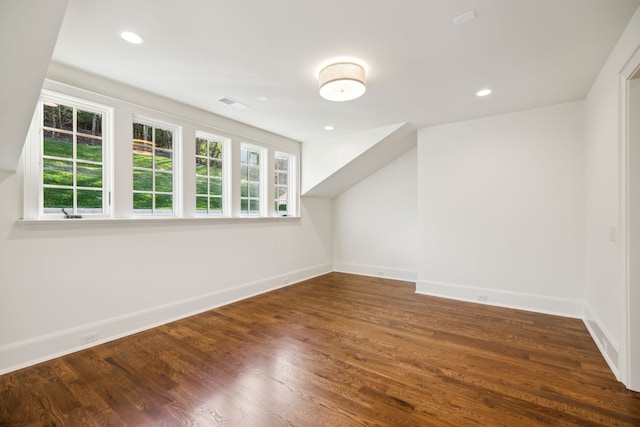 bonus room featuring dark hardwood / wood-style floors