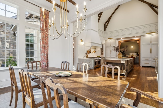 dining space with dark hardwood / wood-style flooring, beamed ceiling, an inviting chandelier, and high vaulted ceiling