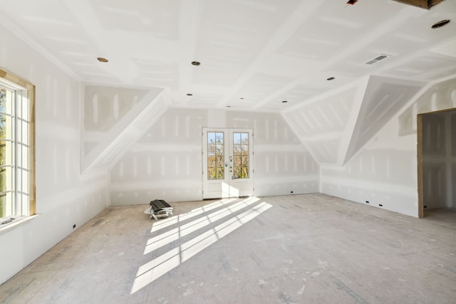 additional living space featuring a wealth of natural light and vaulted ceiling