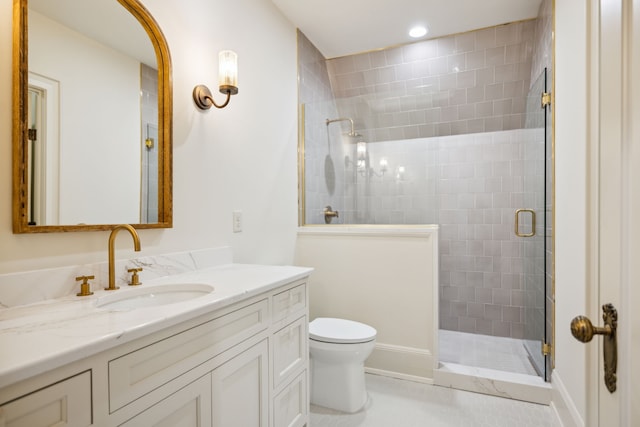 bathroom with toilet, tile patterned flooring, vanity, and walk in shower