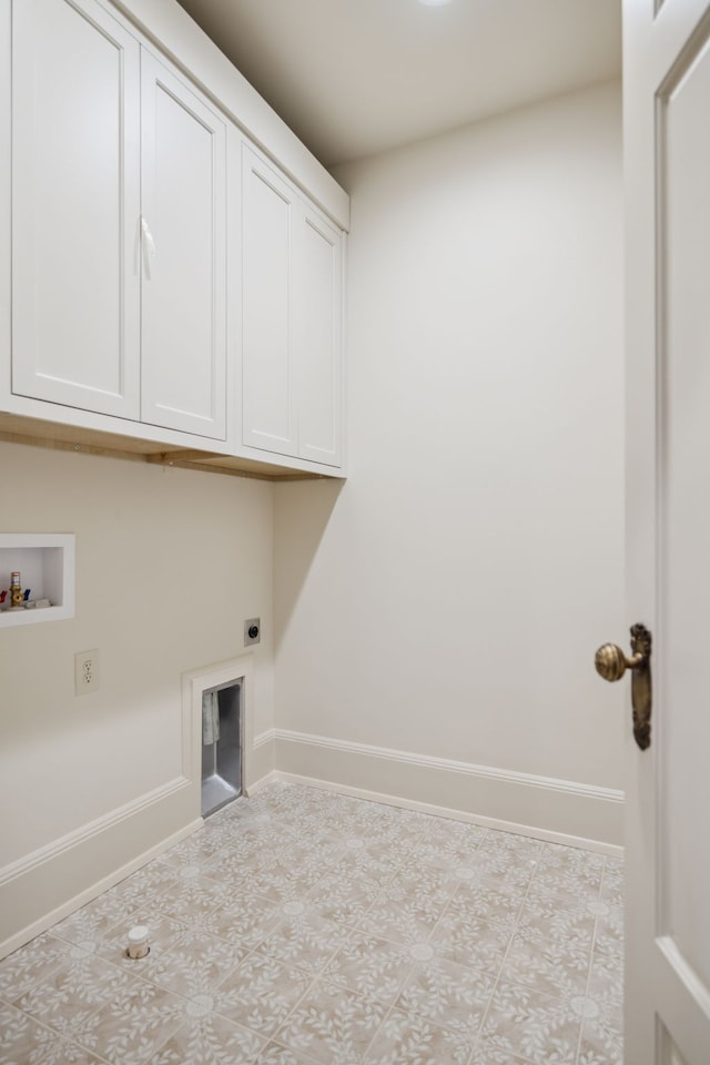 laundry room featuring hookup for an electric dryer, light tile patterned flooring, cabinets, and washer hookup