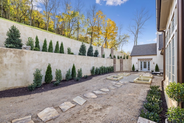 view of yard with french doors