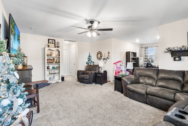 carpeted living room featuring ceiling fan