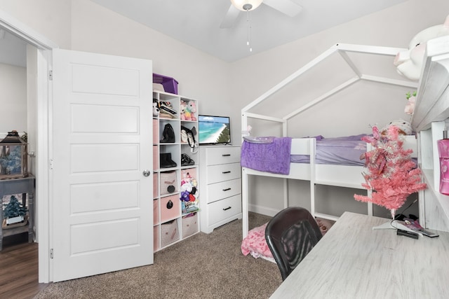 carpeted bedroom featuring ceiling fan and vaulted ceiling