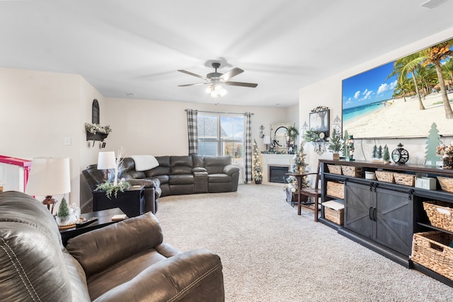 carpeted living room with ceiling fan