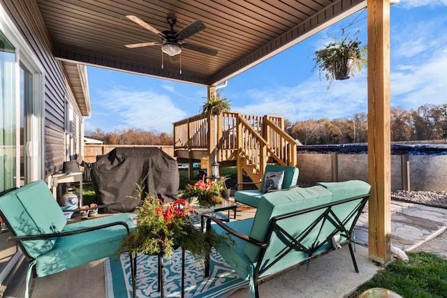 view of patio / terrace with ceiling fan, an outdoor living space, and a wooden deck