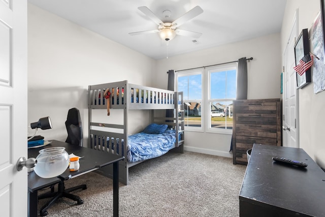 bedroom with ceiling fan and carpet