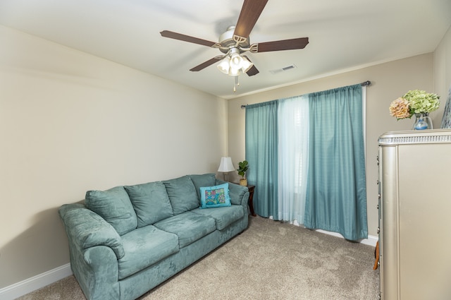 living room featuring carpet flooring and ceiling fan