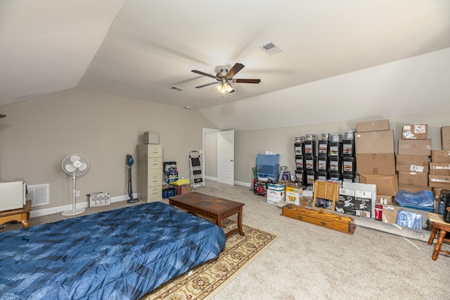 carpeted bedroom featuring ceiling fan and vaulted ceiling