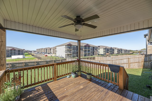 wooden terrace with a yard and ceiling fan