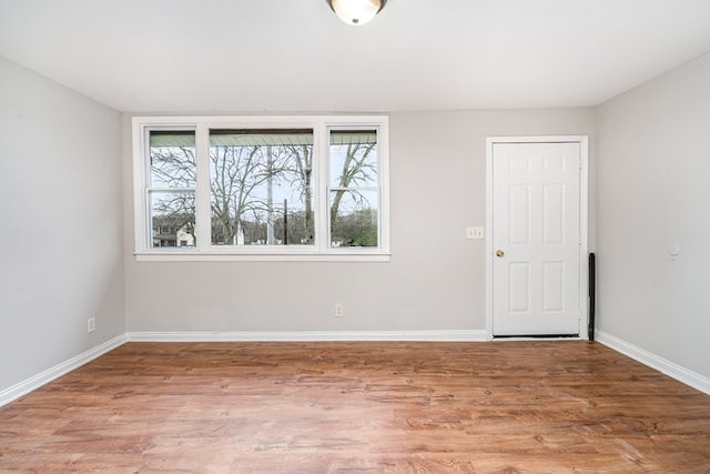 spare room with hardwood / wood-style flooring