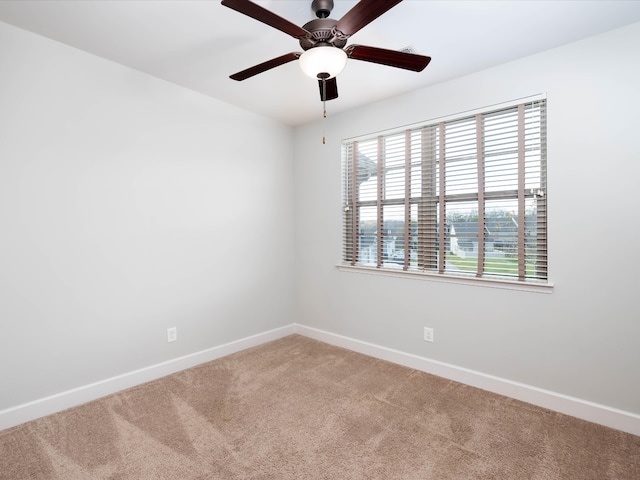 unfurnished room with carpet flooring and ceiling fan