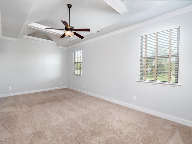 unfurnished room with light carpet, a wealth of natural light, and ceiling fan