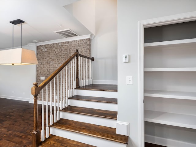 staircase with hardwood / wood-style flooring