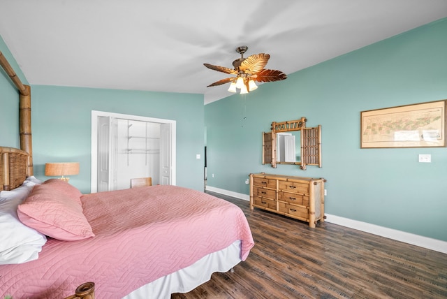 bedroom with a closet, vaulted ceiling, ceiling fan, and dark wood-type flooring