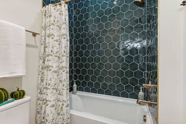 bathroom with shower / bath combo and toilet