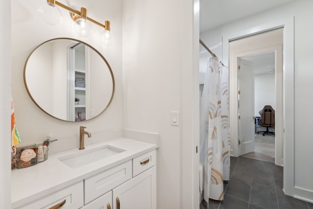 bathroom featuring tile patterned floors, vanity, and a shower with shower curtain