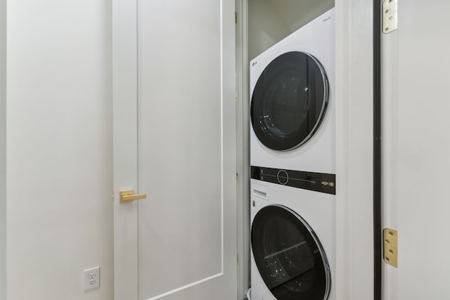 laundry area with stacked washer / drying machine