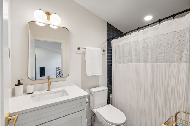 bathroom with a shower with shower curtain, vanity, toilet, and vaulted ceiling