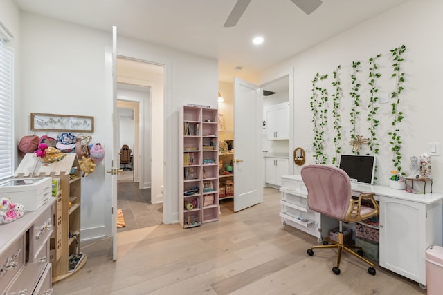 office space featuring ceiling fan and light hardwood / wood-style floors