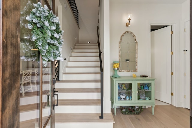 stairway featuring hardwood / wood-style flooring