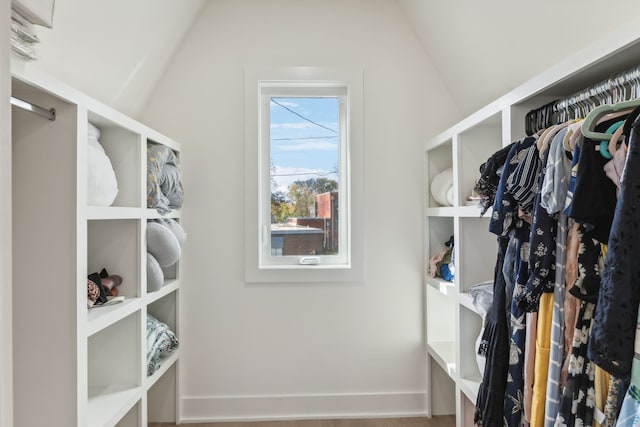 spacious closet featuring hardwood / wood-style flooring and lofted ceiling