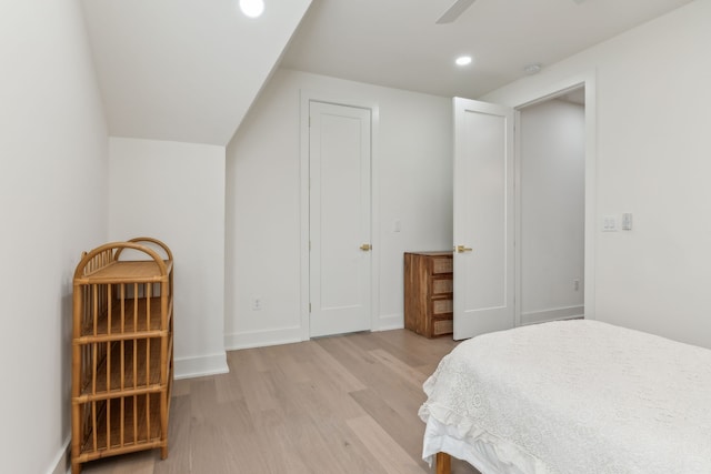 bedroom with ceiling fan and light wood-type flooring